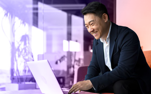 Man looking over the laptop