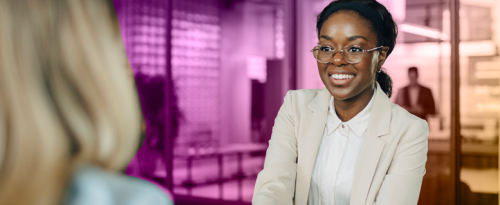 two women handshaking